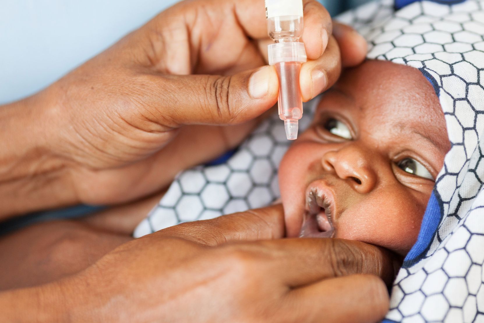 A child having medicine administered