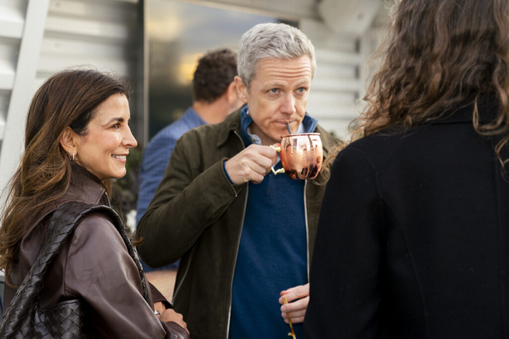 guests attending boston event, man drinking tea