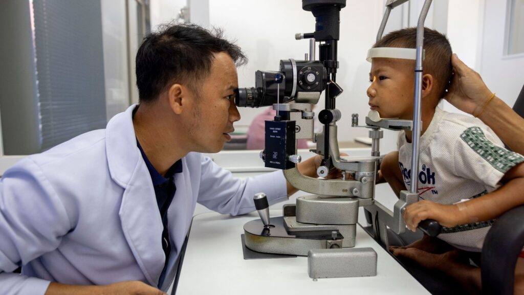 Fred Hollows Foundation Match, doctor conducting eye test