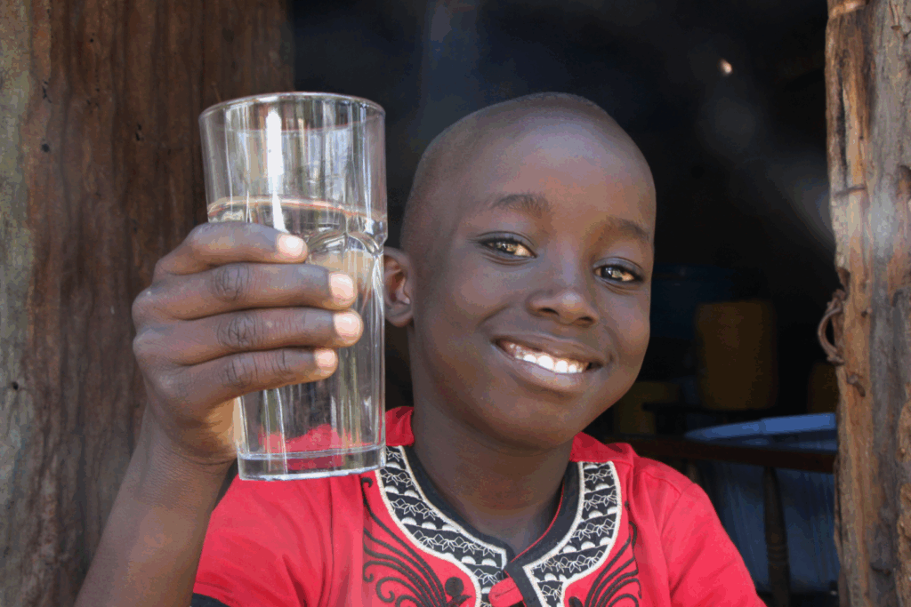 A boy with water. Giving Season
