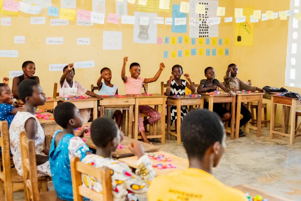 Students in Ghana participate in an interactive math lesson using local materials. Luminos Fund