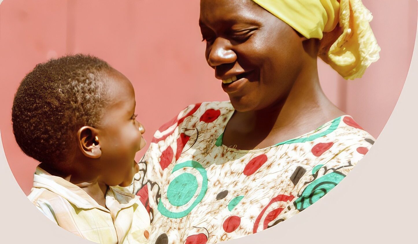 A mother holding her smiling child